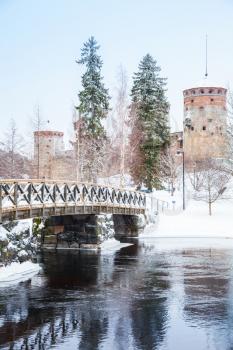Vertical winter landscape of Savonlinna, Finland. Bridge to Olavinlinna castle