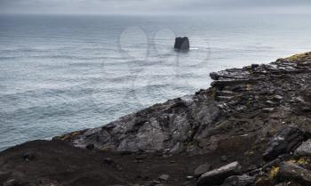Coastal rocks. Scenic landscape of Dyrholaey Nature Reserve of Iceland