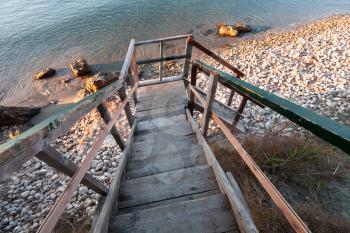 Perspective view of wooden stairs down to beach. Zakynthos island, Greece