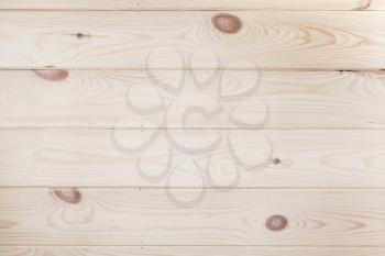 New varnished wooden wall with knots pattern. Frontal flat background photo texture