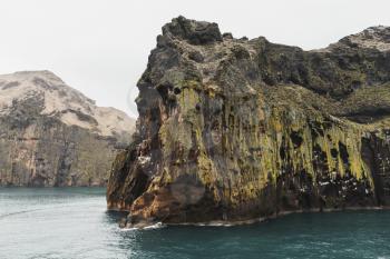 Natural landscape with rocky coast of Vestmannaeyjar island, Iceland