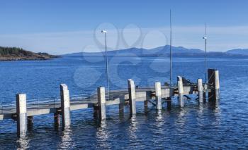 Small empty mooring pier with bumpers, Edoya island, Trondheim region, Norway