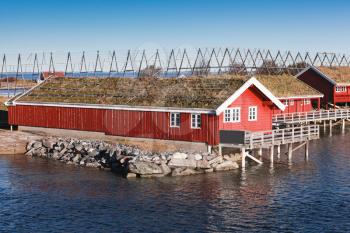 Ringholmen, Norway. Rural Norwegian landscape, traditional red wooden houses on rocky island