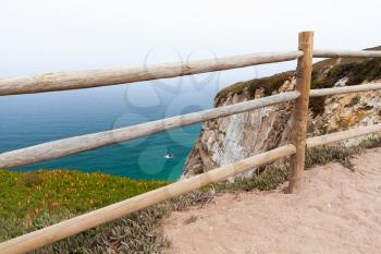 Wooden railings on the edge of Cabo da Roca. Westernmost point Portugal and Europe