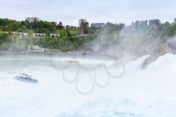 The Rhine Falls. Fast fallen river water with foam and mist