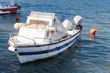 White wooden fishing boat moored in port of Zakynthos, Greek island in the Ionian Sea