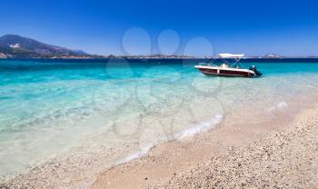 Pleasure motor boat anchored on the beach of Zakynthos island, Greece