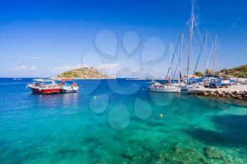 Sailing yachts and pleasure boats moored in Agios Nikolaos. Zakynthos island, Greece. Popular touristic destination