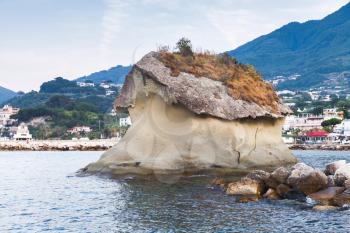 Il Fungo, famous coastal mushroom shaped rock. Lacco Ameno resort town, Ischia island, Italy