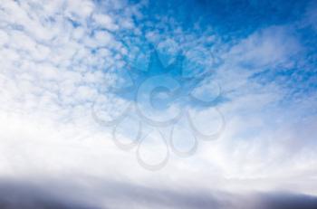 White altocumulus clouds in blue sky at daytime, background photo texture