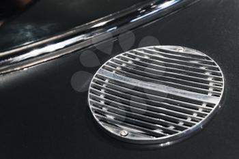 Air intake grille. Luxury vintage sports car fragment, close up photo with selective soft focus