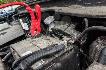 Sport utility vehicle car battery charge in progress