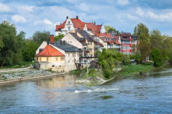 Regensburg landscape in bright summer day, view from the Stone Bridge over Danube River, Germany