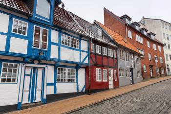 Street view perspective with traditional colorful living houses. Flensburg city, Germany