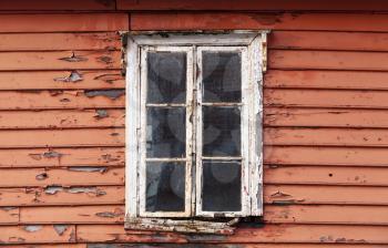 Old red wooden wall with window in white frame, Scandinavian living house architecture detail
