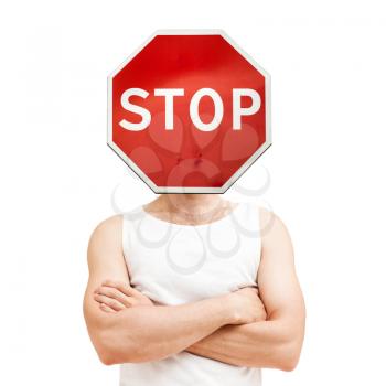Do not disturb concept. Young sporty Caucasian man with stop sign over face in white shirt with crossing hands isolated on white