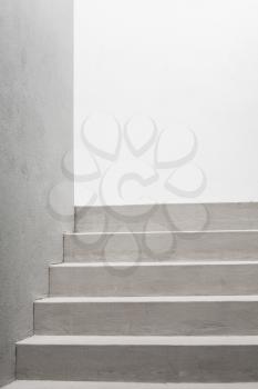 Abstract architecture, vertical background photo. White stairs, empty interior fragment