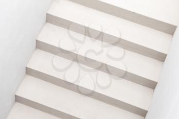 Abstract architecture background photo. White stairs, top view, empty interior fragment