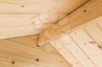 Abstract wooden interior fragment, inner side of a rooftop