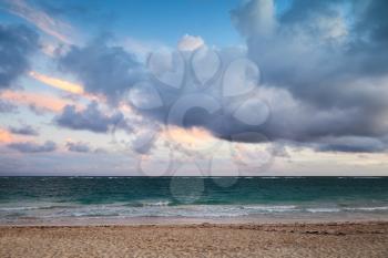 Atlantic ocean coast, empty landscape with dramatic cloudy sky in sunrise, Dominican republic. Punta Cana. Bavaro beach