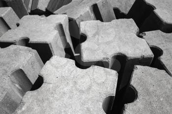Rough gray concrete blocks. Breakwater structure for protection from ocean stormy waves 