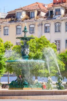 Bronze fountain on the Rossio Square or Pedro IV Square, Lisbon, Portugal. It was imported from France in the 19th century
