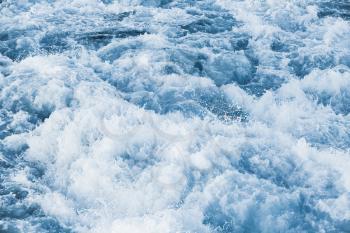 Stormy sea water with splashes and foam, natural background photo texture