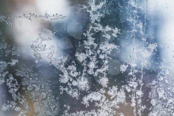 Frost pattern on window glass close up abstract background photo texture