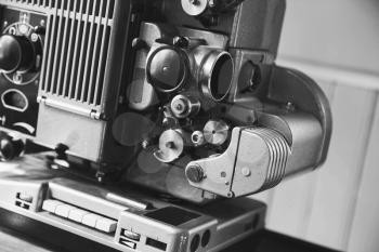 Vintage film projector, close up black and white photo with selective focus