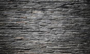 Decorative dark stone wall, flat background photo texture