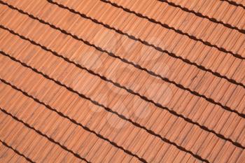 Traditional red roof tiling, background photo texture