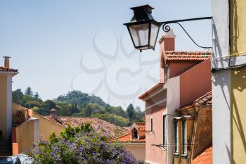 Streetlight of old Sintra, Portugal. Colorful living houses facades
