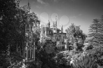 Romantic palace and chapel of Quinta da Regaleira located near in Sintra, Portugal. It was completed in 1910 and now is classified as a World Heritage Site by UNESCO. Black and white photo