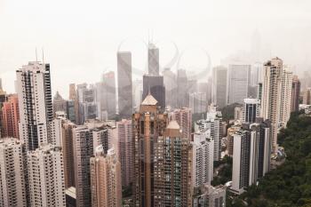 Hong Kong skyline city in foggy day, aerial view taken from Victoria Peak viewpoint