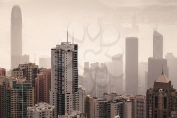 Skyline of Hong Kong city in foggy day, aerial view taken from Victoria Peak viewpoint