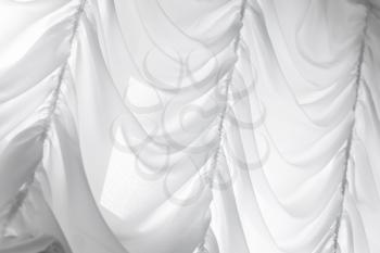 White waving tulle curtain. Background photo texture