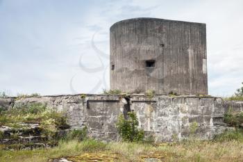 Old concrete bunker tower from WWII period on Totleben fort island in Gulf of Finland near Saint-Petersburg in Russia