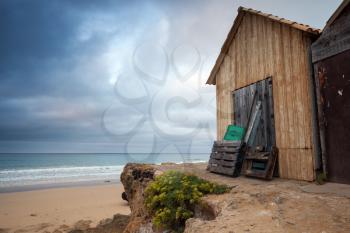 Wooden barns on the beach in early morning. Porto Santo island in the Madeira archipelago, Portugal