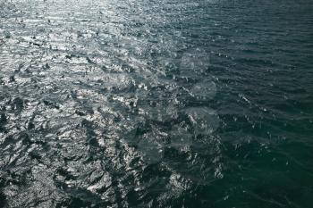 Shining surface of Atlantic Ocean water, background photo texture
