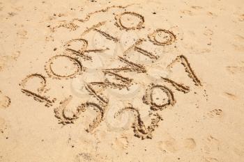 Writings on wet sand. Beach of the island of Porto Santo in the Madeira archipelago, Portugal