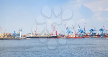 Italy. Port of Naples, coastal cityscape with cargo ships near container terminal
