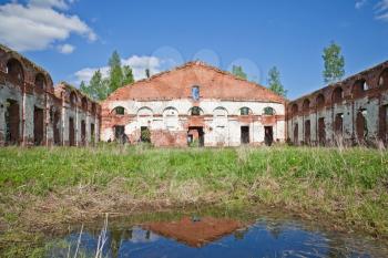 Abandoned landmark: ruins of old military quarters. Was built in 6 years from 1818. Architect - Vasily Petrovich Stasov. Selishi village, Novgorod region, Russia