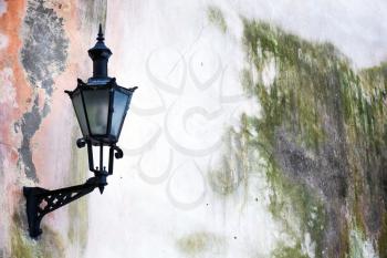 Old Lantern on a weathered wall in Tallinn, Estonia