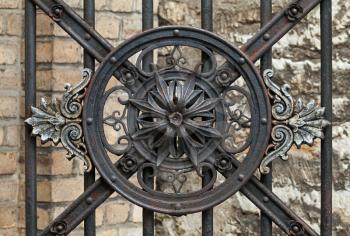 Vintage forged decorative element on metal gate in old part of Tallinn, Estonia