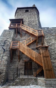 Ancient stone fortress with wooden stairs in old Tallinn, Estonia