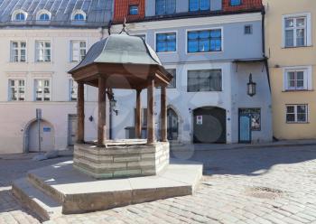 Ancient well on the square in old town of Tallinn, Estonia