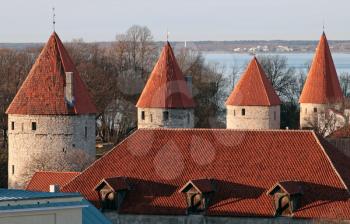 Row of fortress towers with red roofs in old Tallinn, Estonia