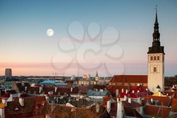 St. Nicholas Church and moon in old town of Tallinn, Estonia