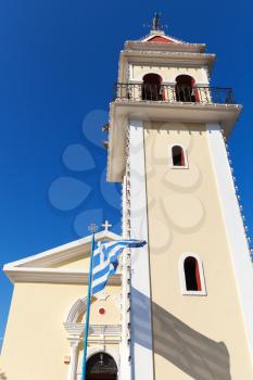Church of Zoodochos Pigi. Exterior with Greek flag in summer day. Zakynthos island, Greece