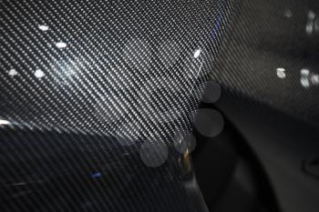 Luxury Italian sports car fragment, body elements made of carbon fiber